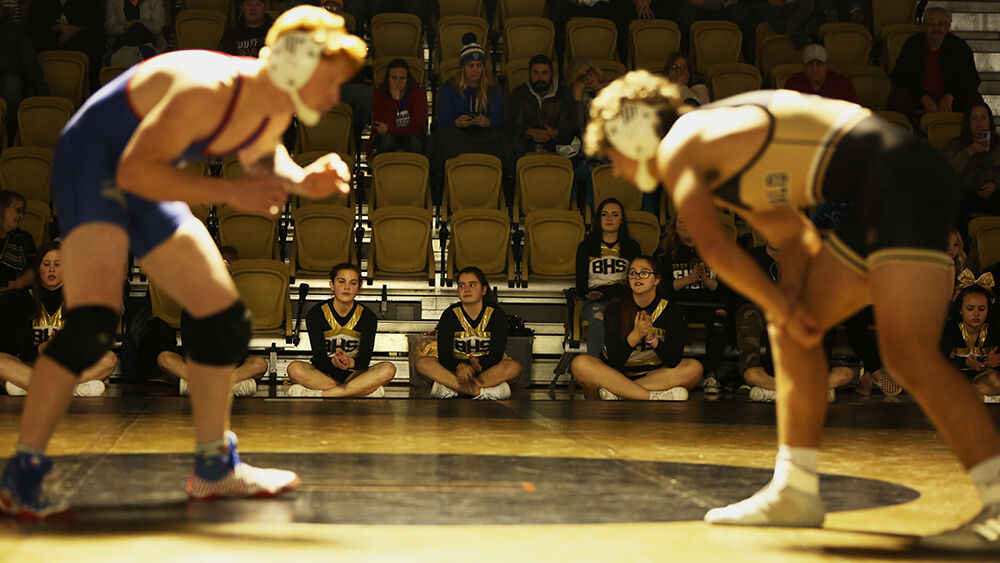Buffalo High School’s cheerleaders lined the edge of the mat